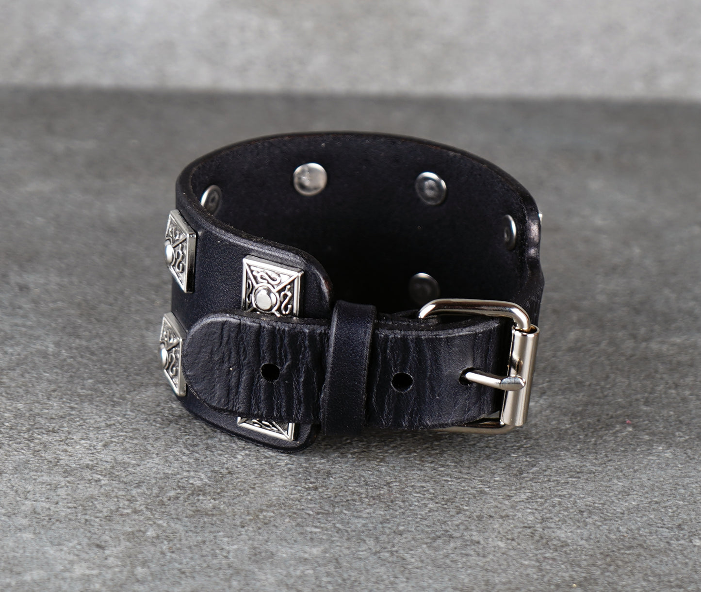 Black leather bracelet with silver geometric studs