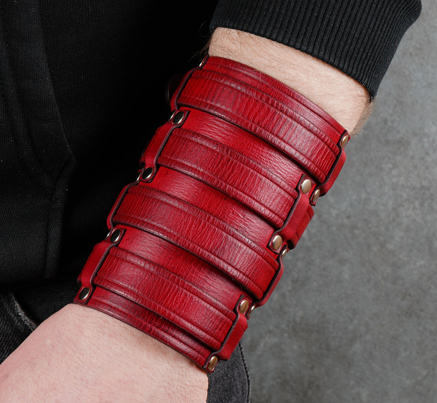 Wide red leather cuff bracelet handmade from vegetable-tanned leather, minimalist design