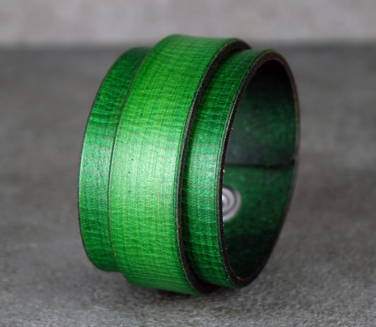 Green textured bracelet on a gray surface