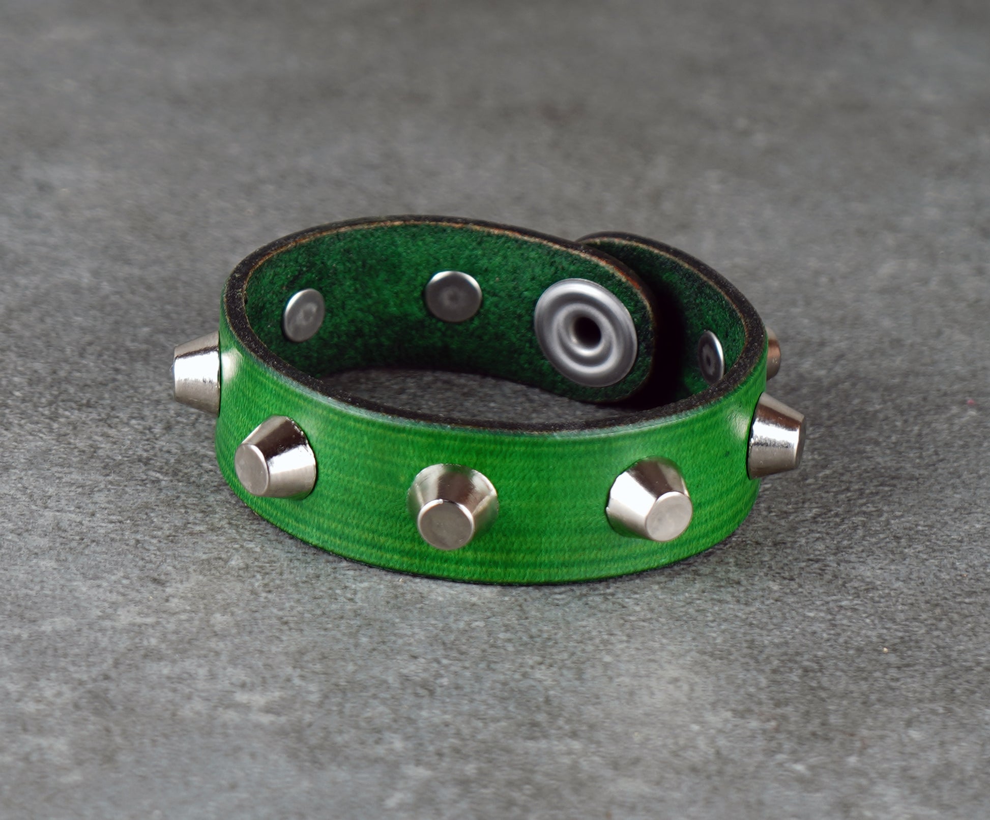 Green leather bracelet with metallic studs