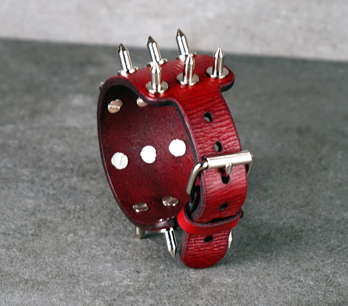 adjustable red spiked leather wrist cuff