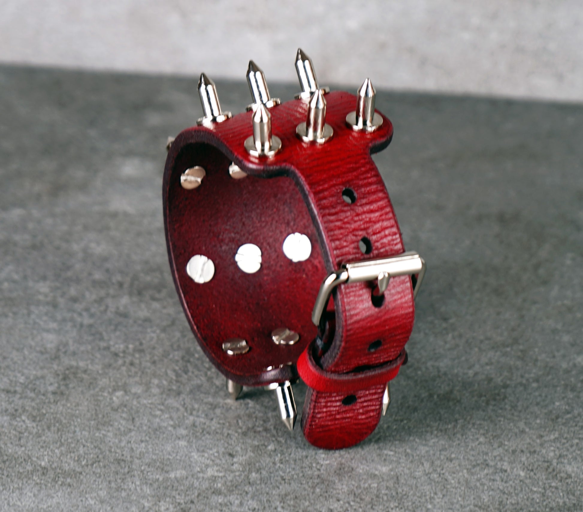 adjustable red spiked leather wrist cuff