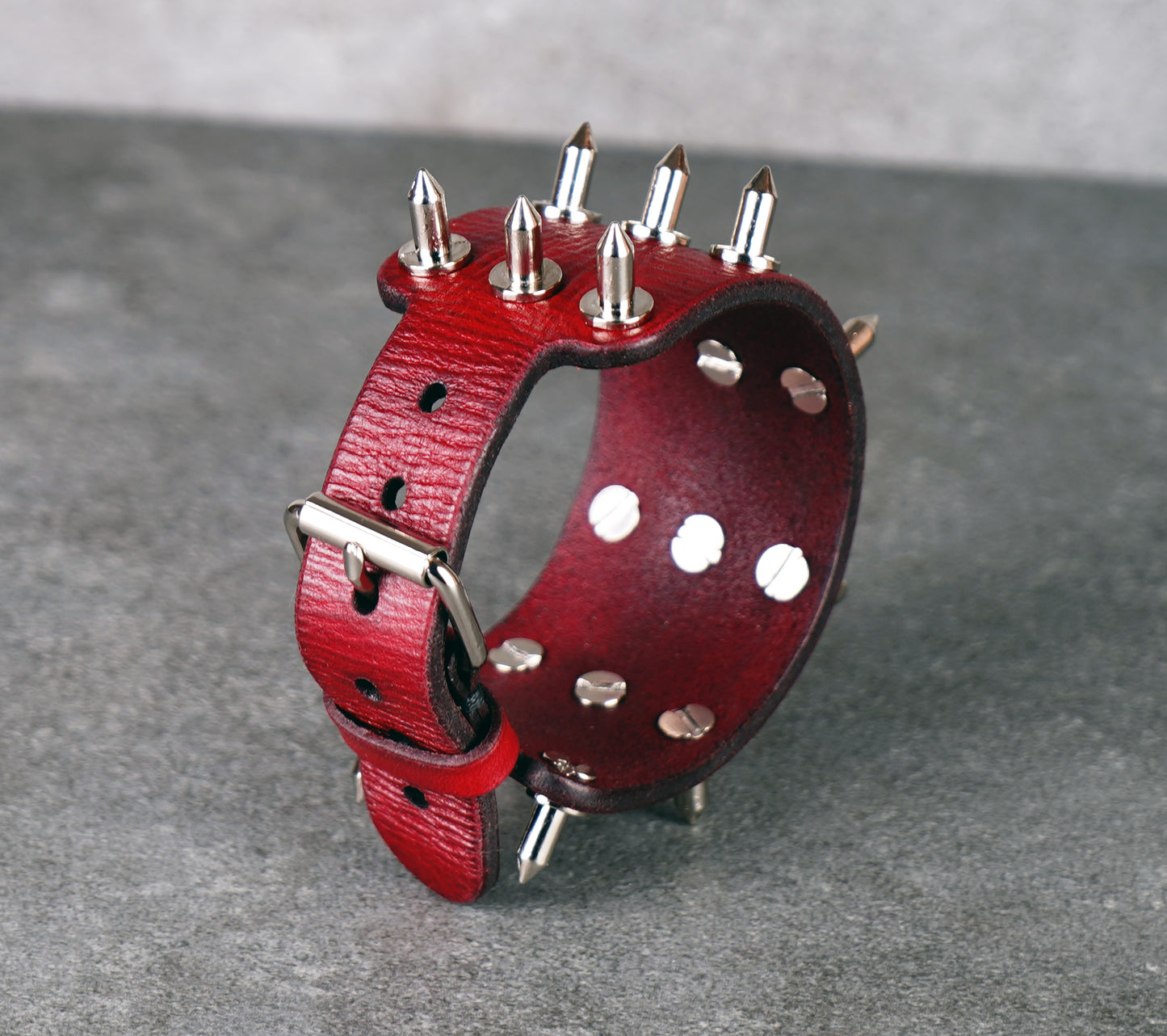 adjustable red spiked leather wrist cuff