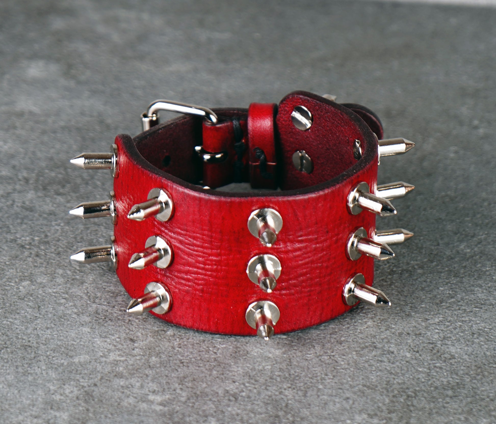 adjustable red spiked leather wrist cuff