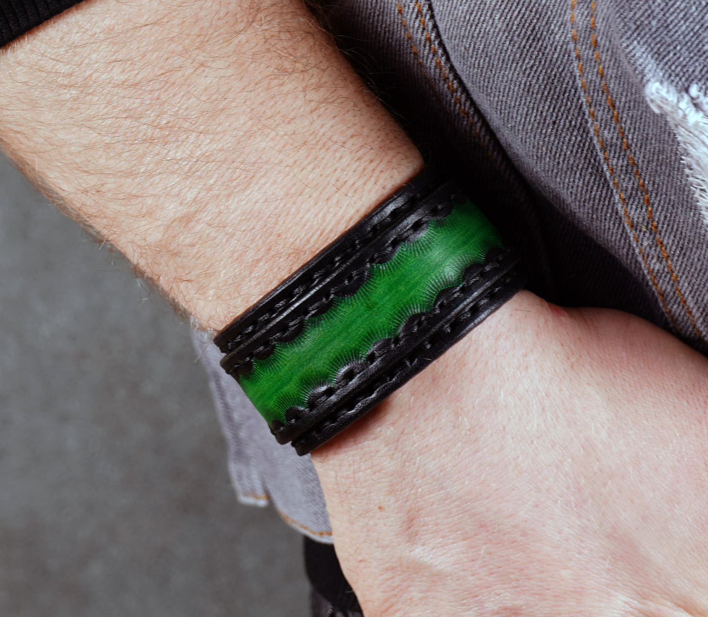 handmade black green leather cuff bracelet close up textured vegetable tanned leather