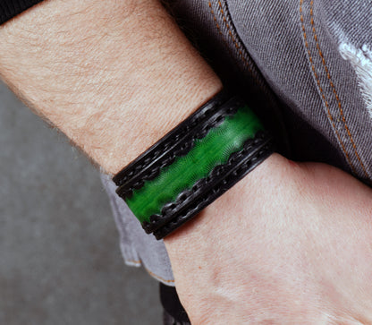 handmade black green leather cuff bracelet close up textured vegetable tanned leather