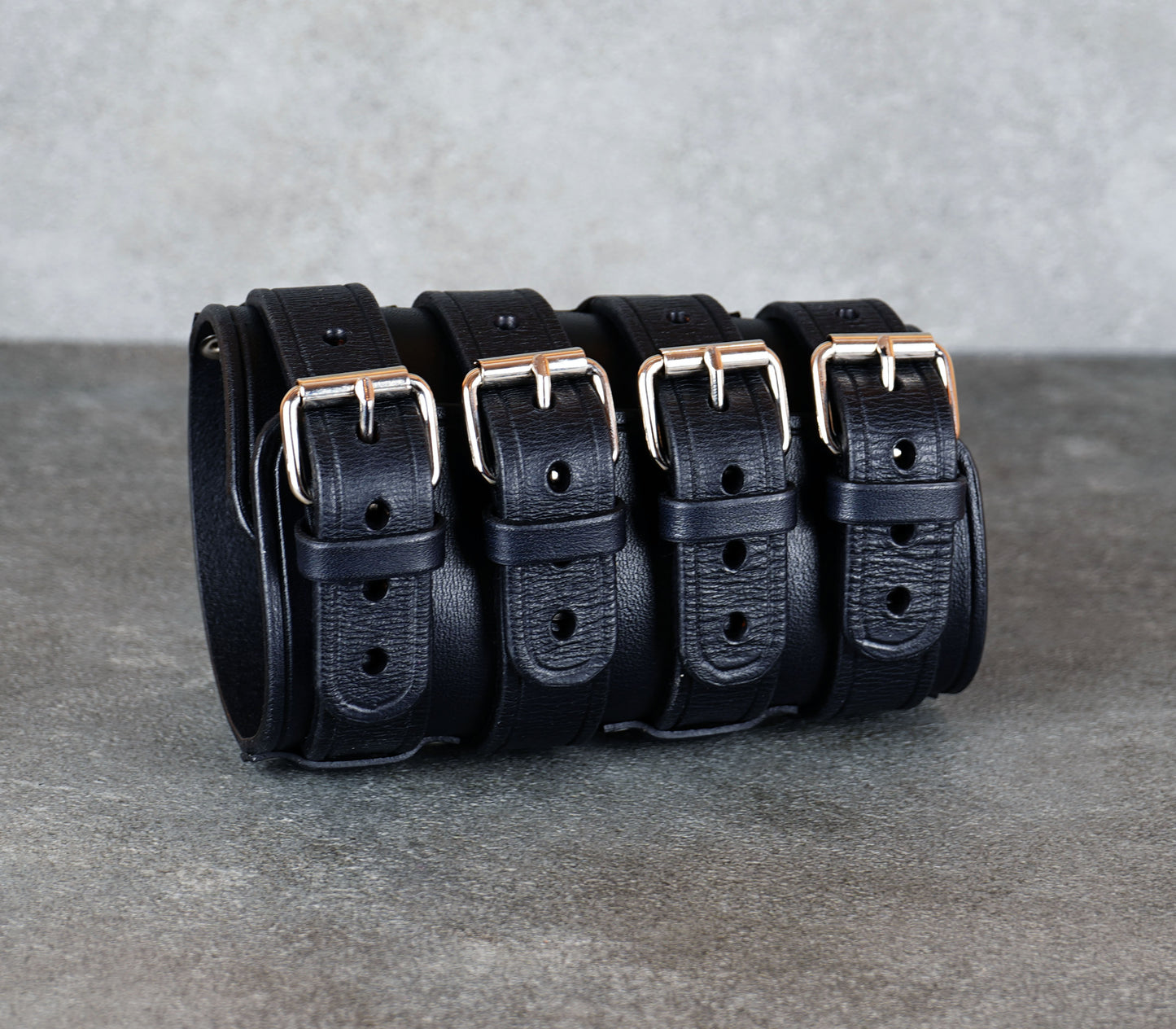 Wide black leather cuff bracelet handmade from vegetable-tanned leather, minimalist design