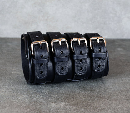 Wide black leather cuff bracelet handmade from vegetable-tanned leather, minimalist design