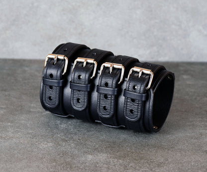 Wide black leather cuff bracelet handmade from vegetable-tanned leather, minimalist design