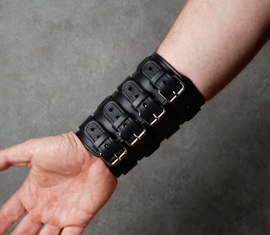 Wide black leather cuff bracelet handmade from vegetable-tanned leather, minimalist design