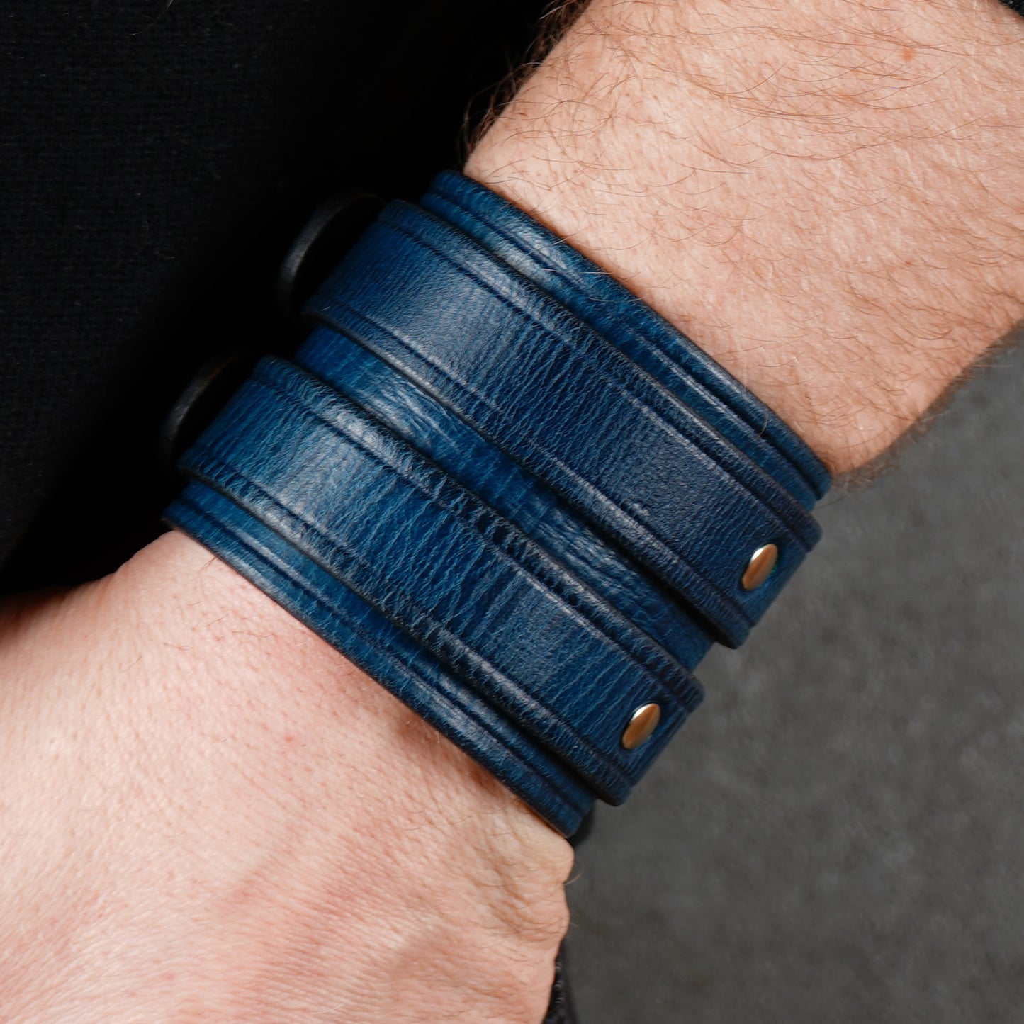 Blue leather cuff bracelet with two buckles