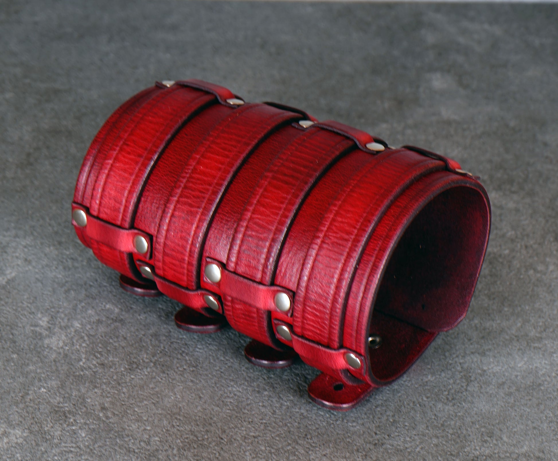 Wide red leather cuff bracelet handmade from vegetable-tanned leather, minimalist design