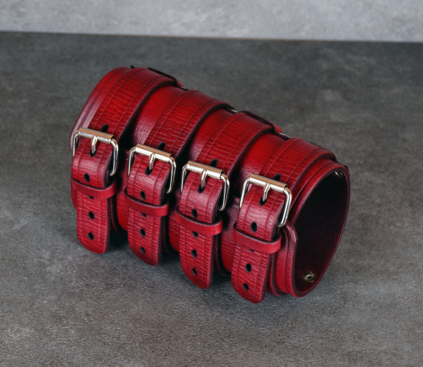 Wide red leather cuff bracelet handmade from vegetable-tanned leather, minimalist design