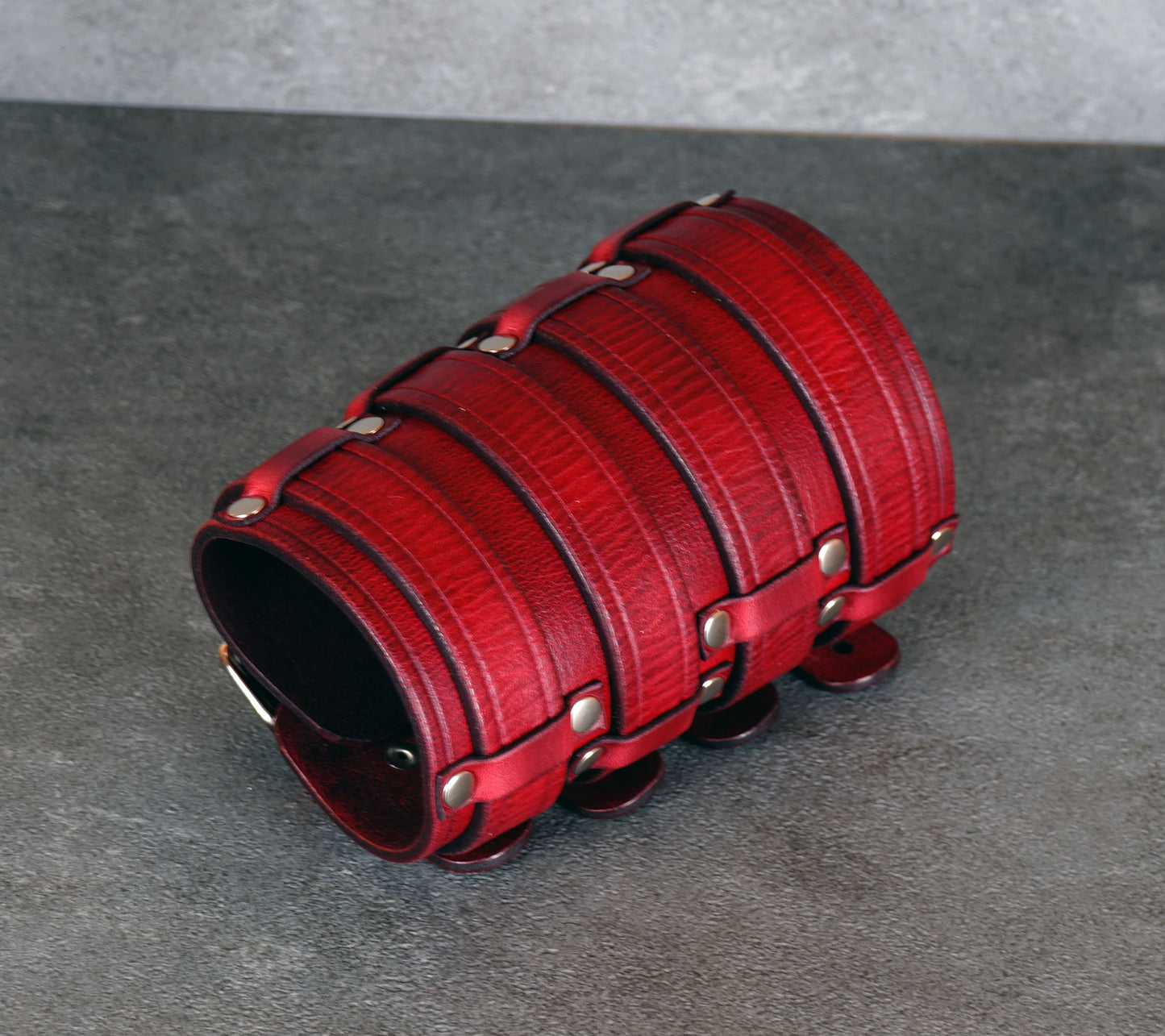 Wide red leather cuff bracelet handmade from vegetable-tanned leather, minimalist design