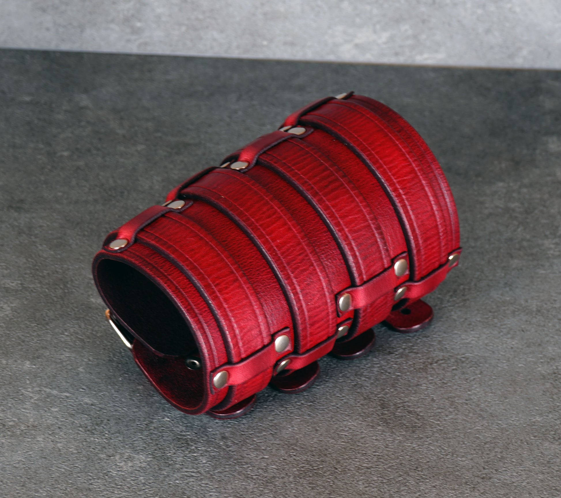 Wide red leather cuff bracelet handmade from vegetable-tanned leather, minimalist design