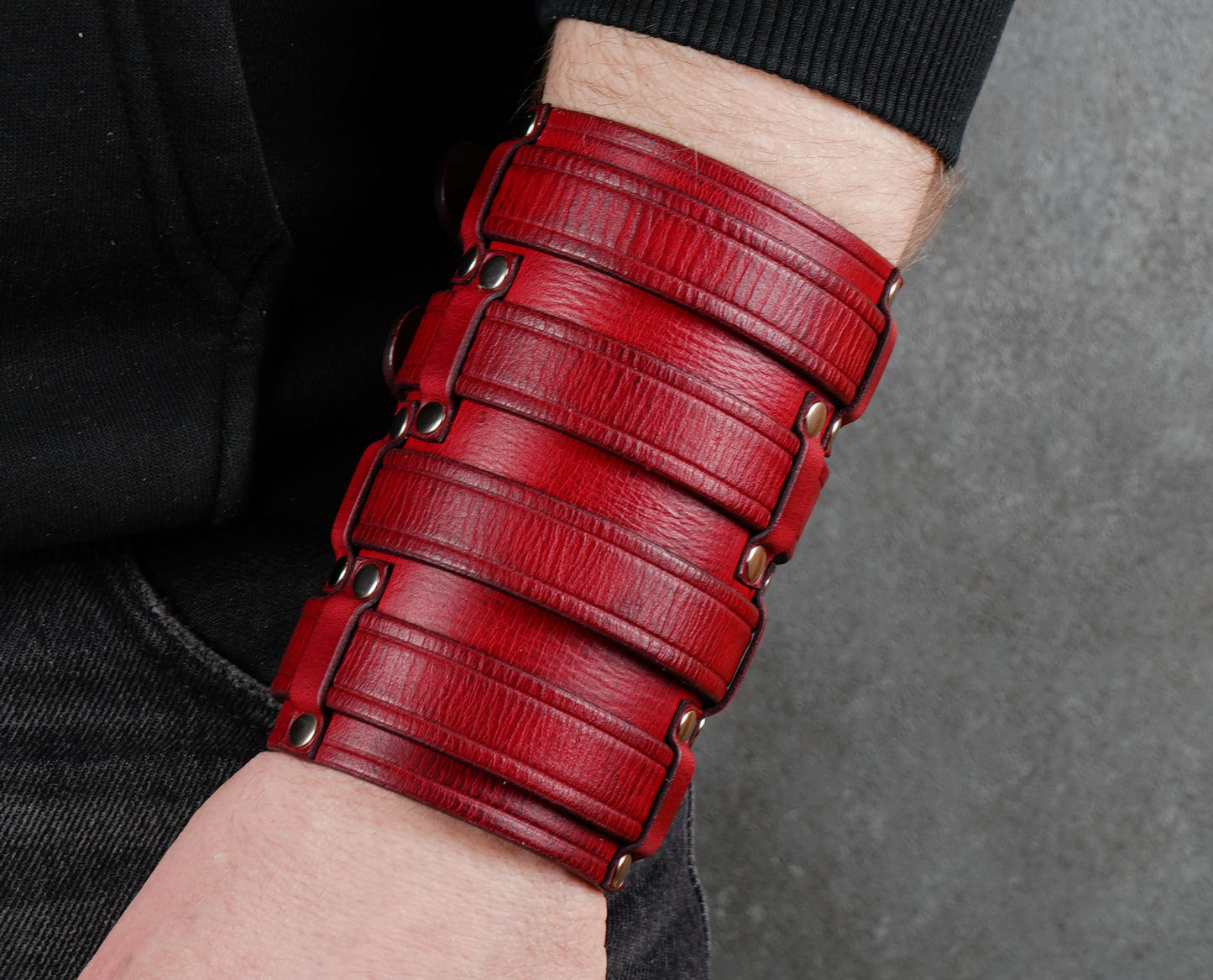 Wide red leather cuff bracelet handmade from vegetable-tanned leather, minimalist design