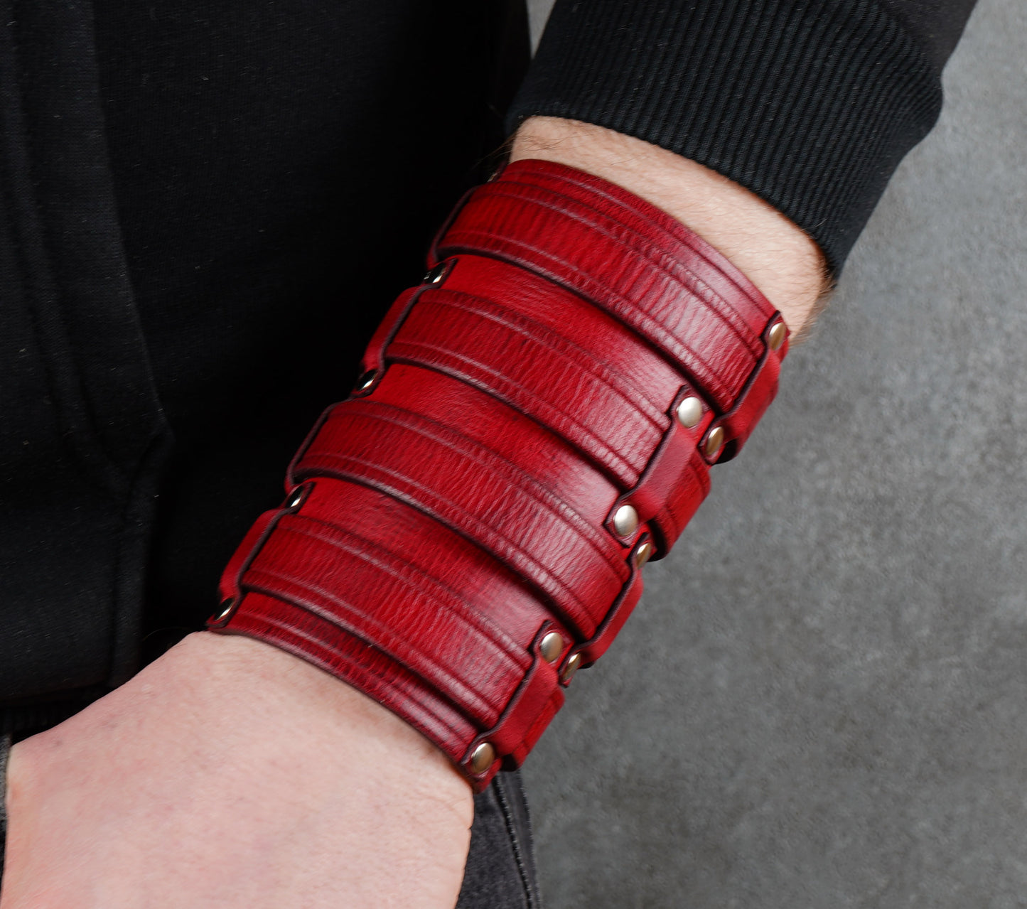 Wide red leather cuff bracelet handmade from vegetable-tanned leather, minimalist design
