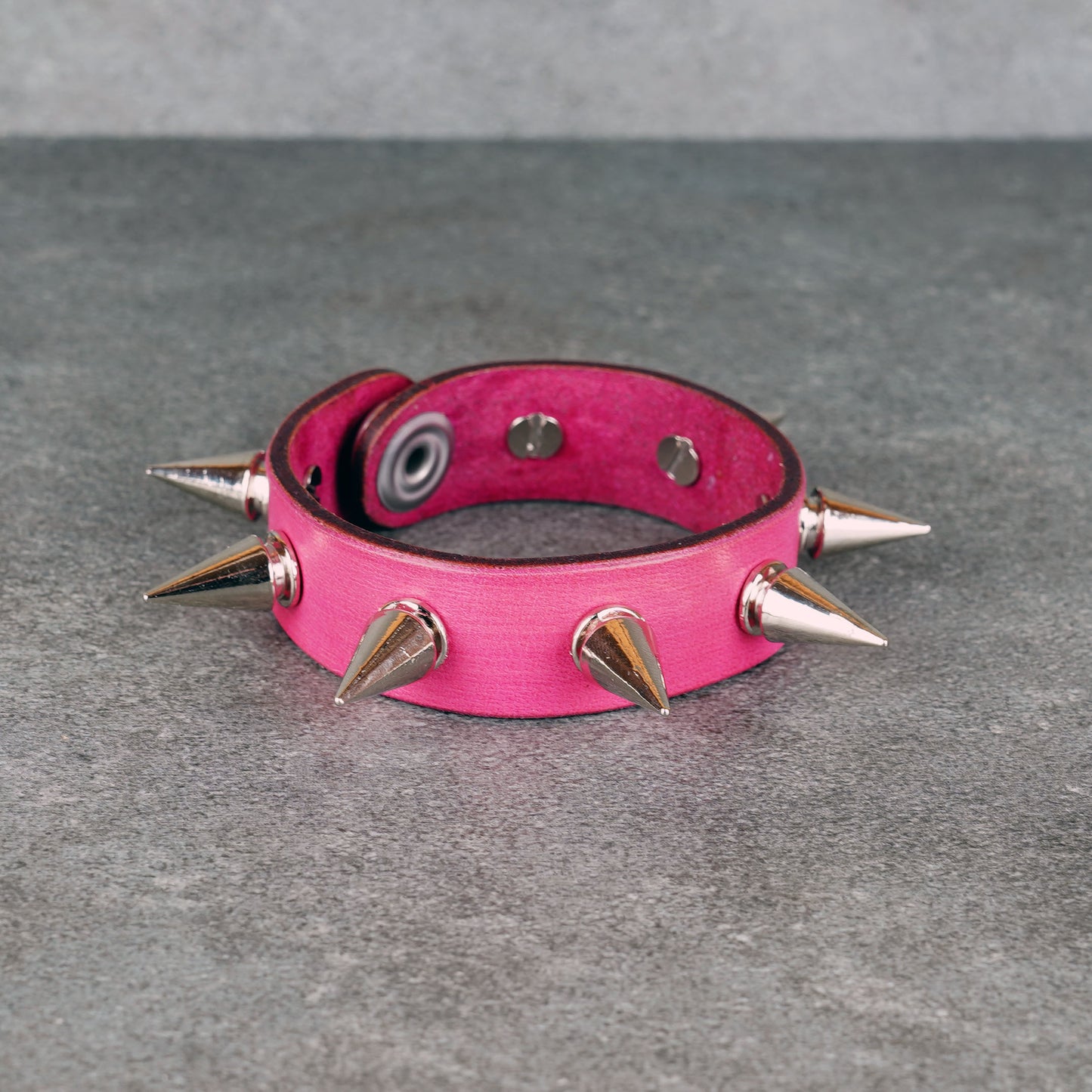 Spiked pink leather bracelet made from genuine leather
