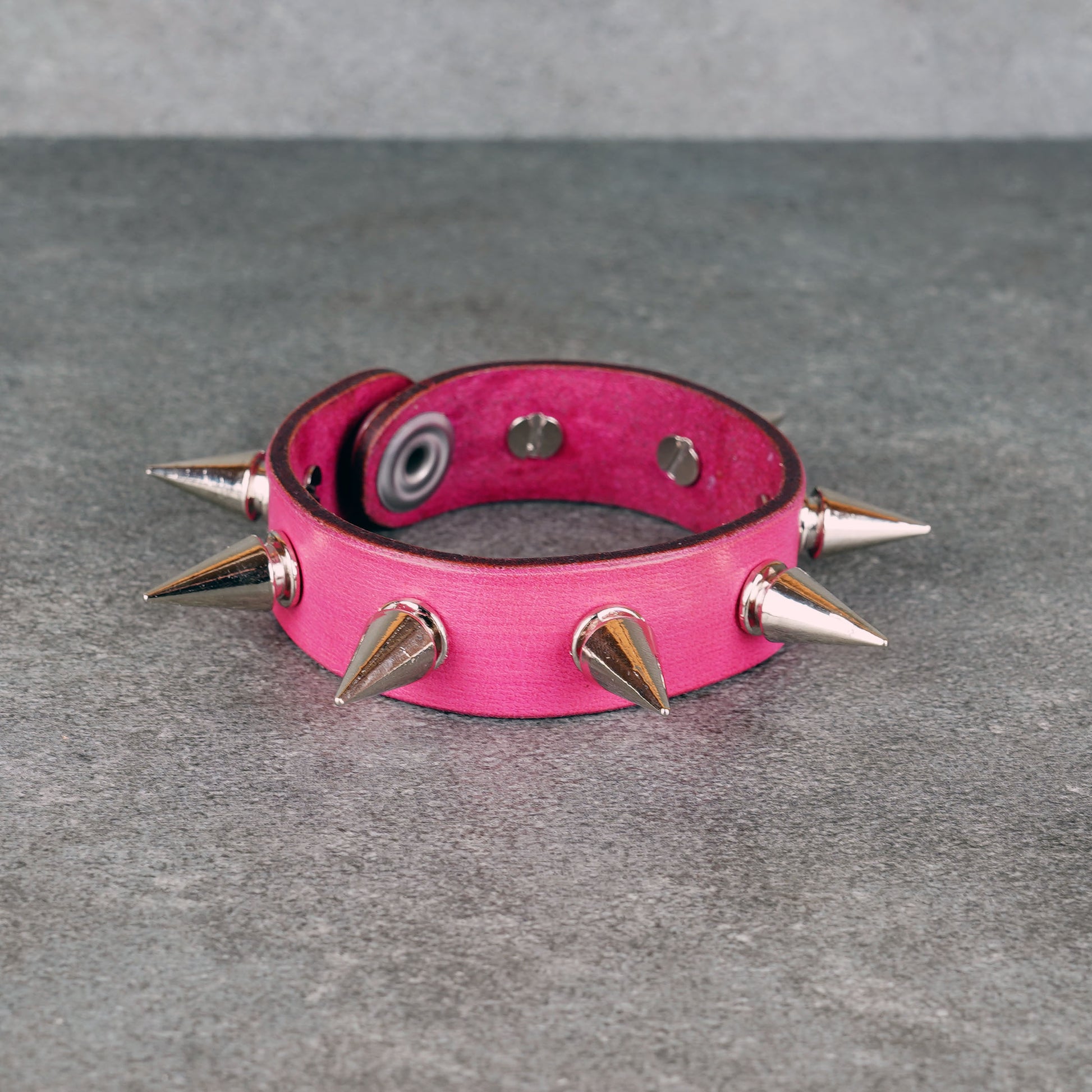 Spiked pink leather bracelet made from genuine leather