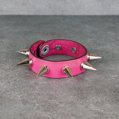 Spiked pink leather bracelet made from genuine leather
