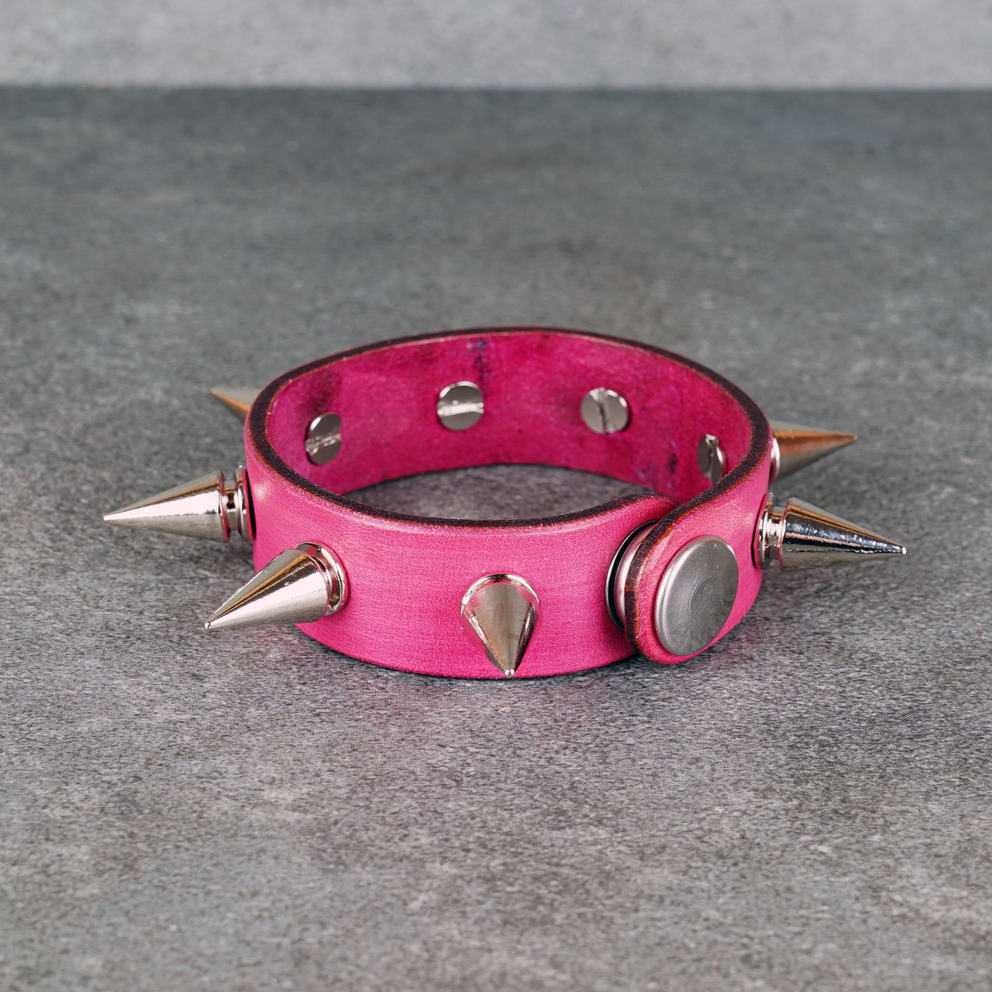 Spiked pink leather bracelet made from genuine leather