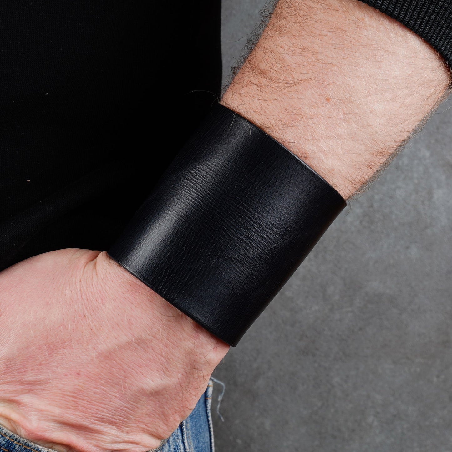 Minimalist black leather cuff bracelet, handmade unisex wide wristband in genuine leather with sleek modern style