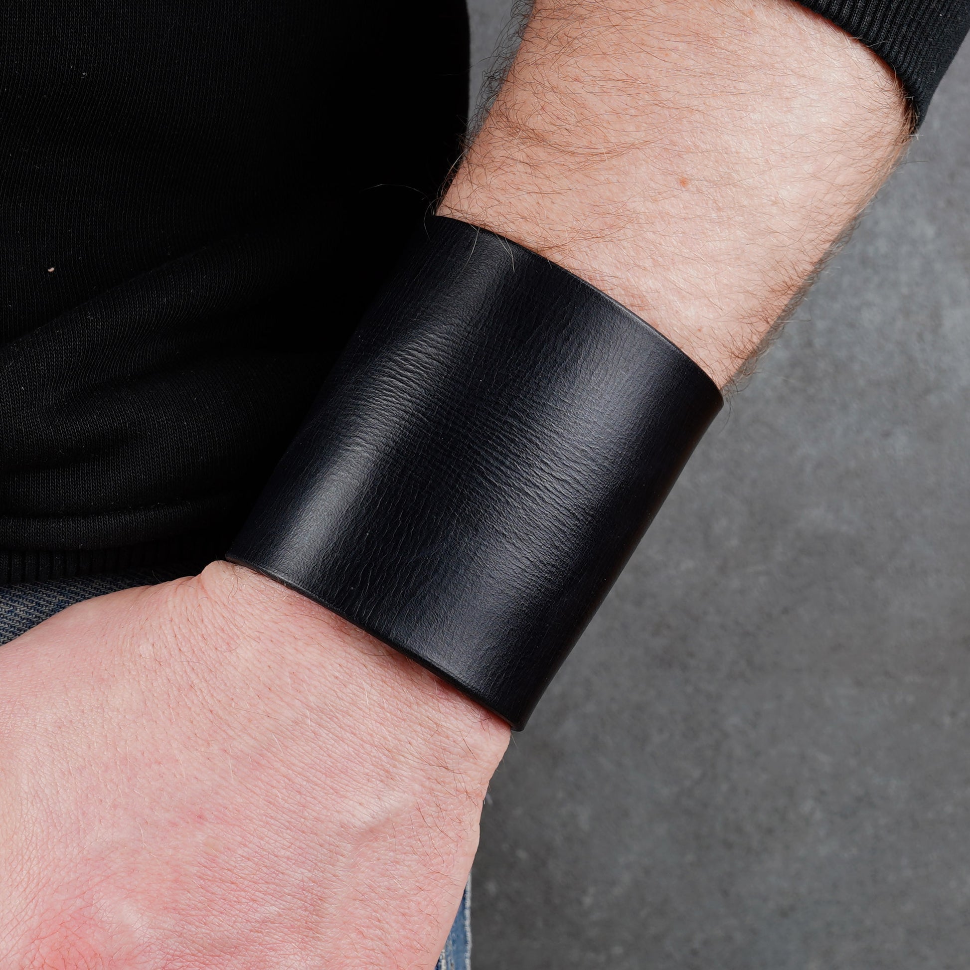 Minimalist black leather cuff bracelet, handmade unisex wide wristband in genuine leather with sleek modern style
