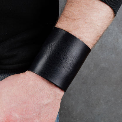 Minimalist black leather cuff bracelet, handmade unisex wide wristband in genuine leather with sleek modern style