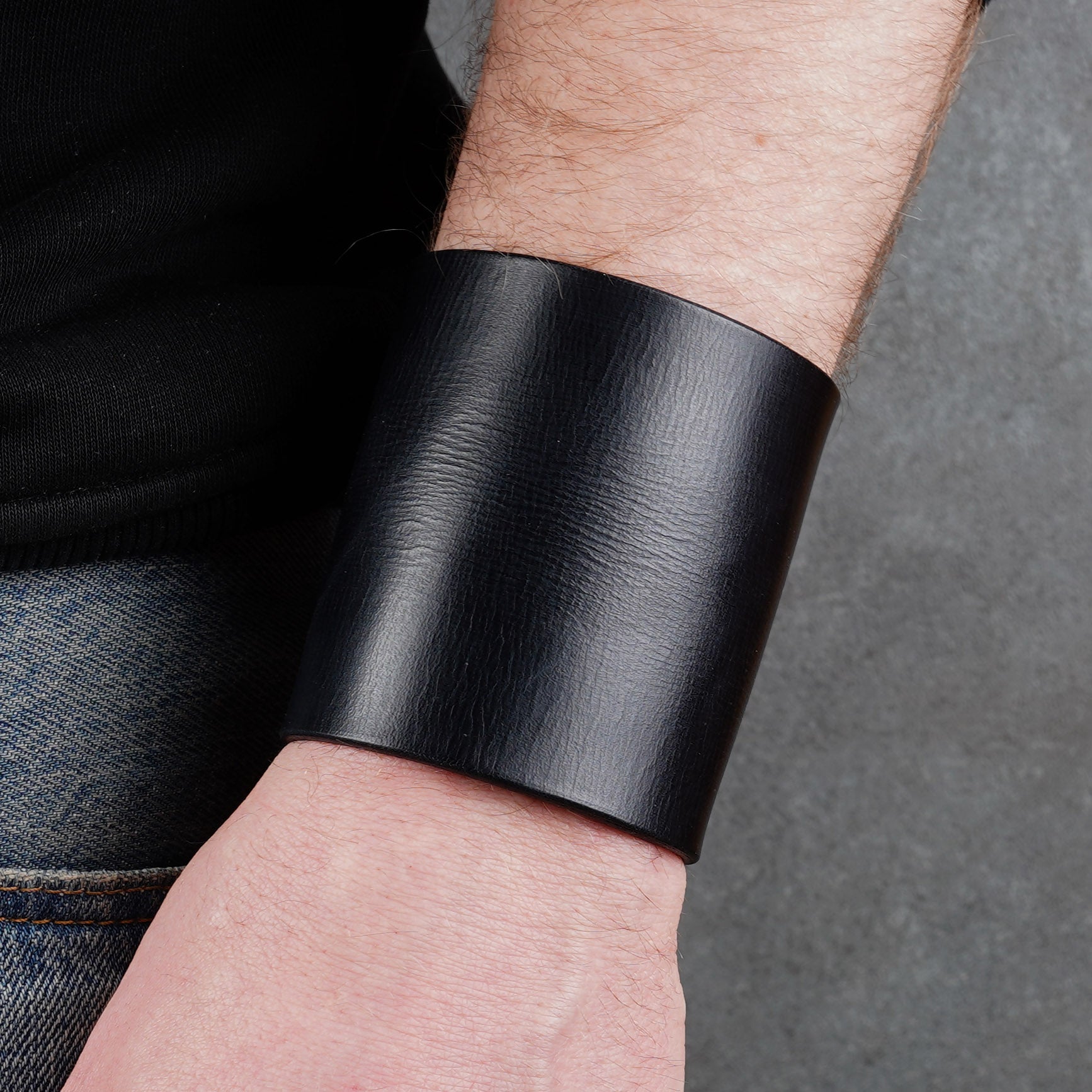 Minimalist black leather cuff bracelet, handmade unisex wide wristband in genuine leather with sleek modern style
