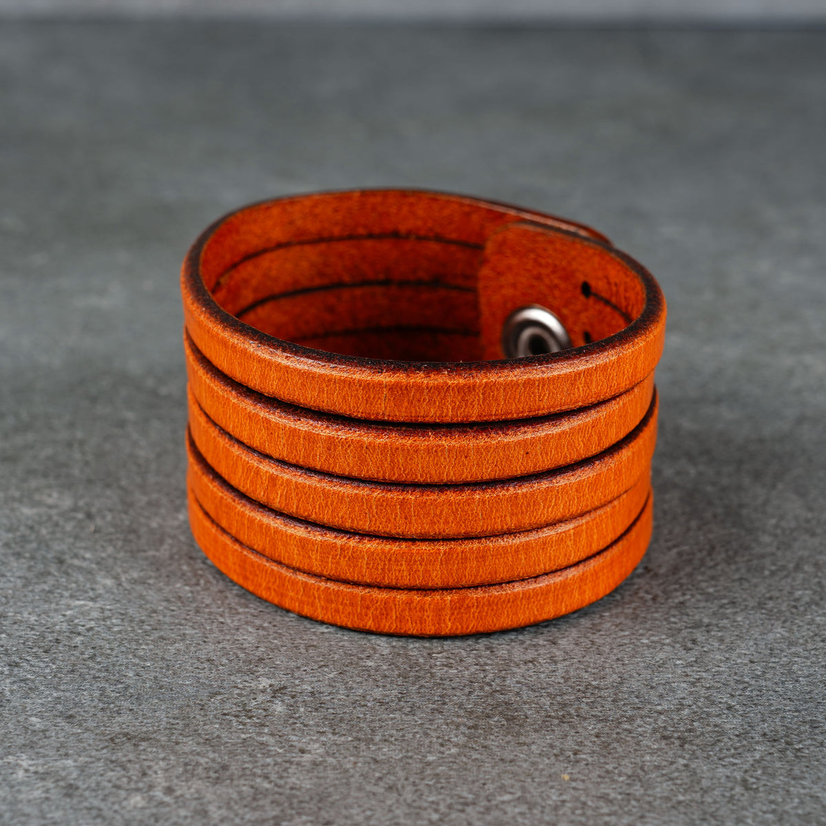 Close view of the cuff opening with the snap hardware partly visible