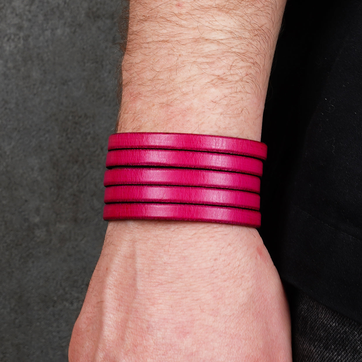 Pink leather wrap bracelet worn on wrist, handmade genuine leather cuff bracelet with layered strap design, minimalist magenta wristband for men and women

