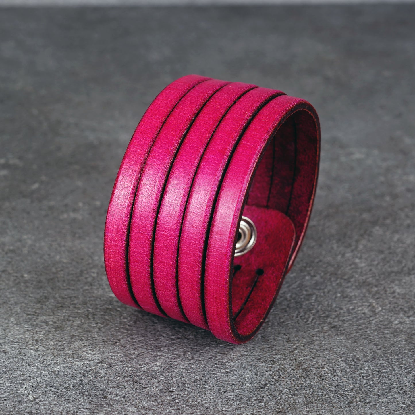 Pink leather wrap bracelet worn on wrist, handmade genuine leather cuff bracelet with layered strap design, minimalist magenta wristband for men and women
