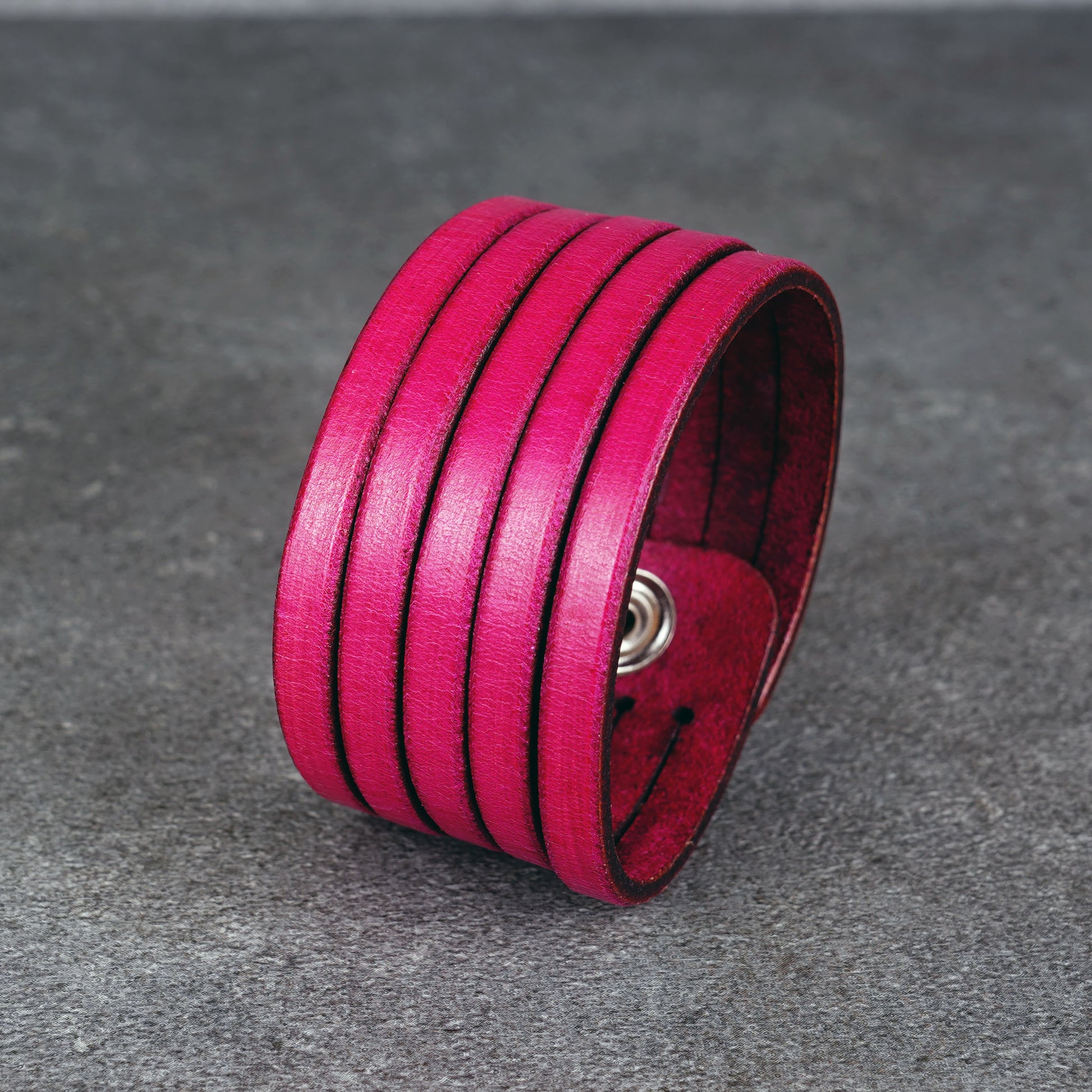 Pink leather wrap bracelet worn on wrist, handmade genuine leather cuff bracelet with layered strap design, minimalist magenta wristband for men and women
