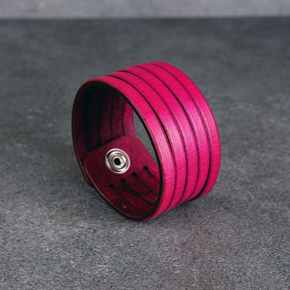 Pink leather wrap bracelet worn on wrist, handmade genuine leather cuff bracelet with layered strap design, minimalist magenta wristband for men and women
