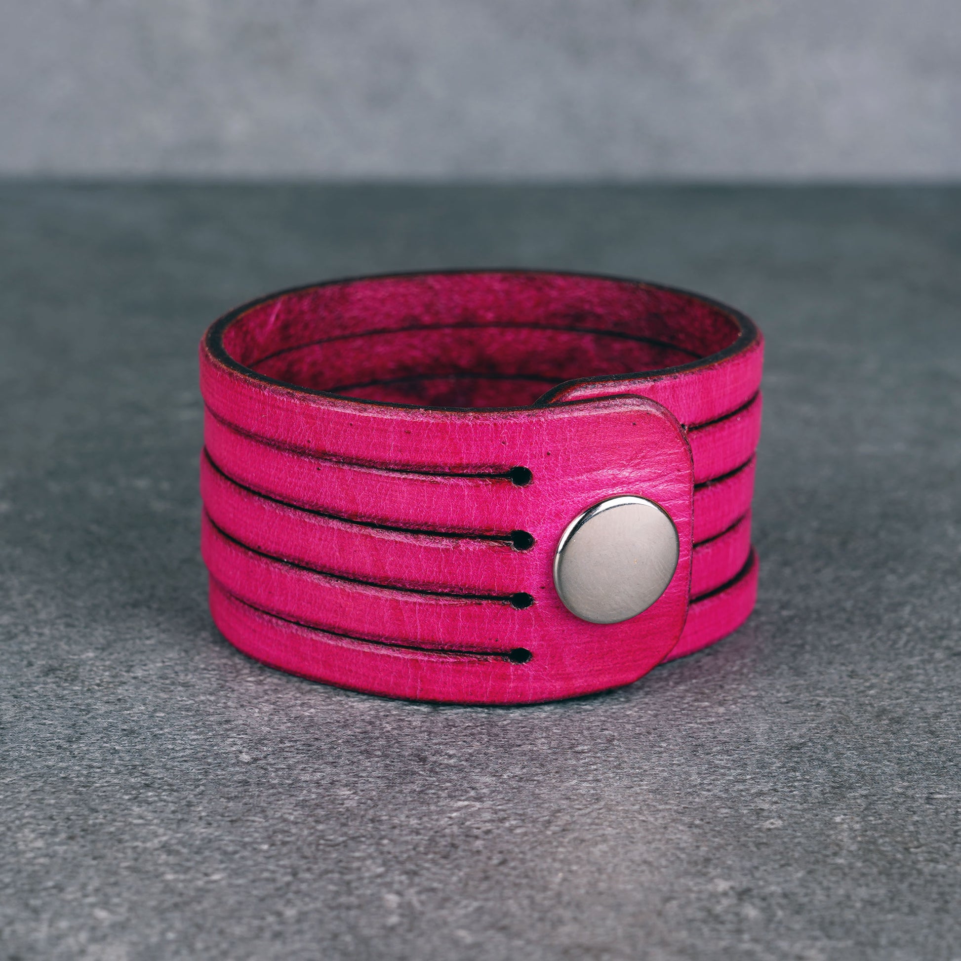 Pink leather wrap bracelet worn on wrist, handmade genuine leather cuff bracelet with layered strap design, minimalist magenta wristband for men and women
