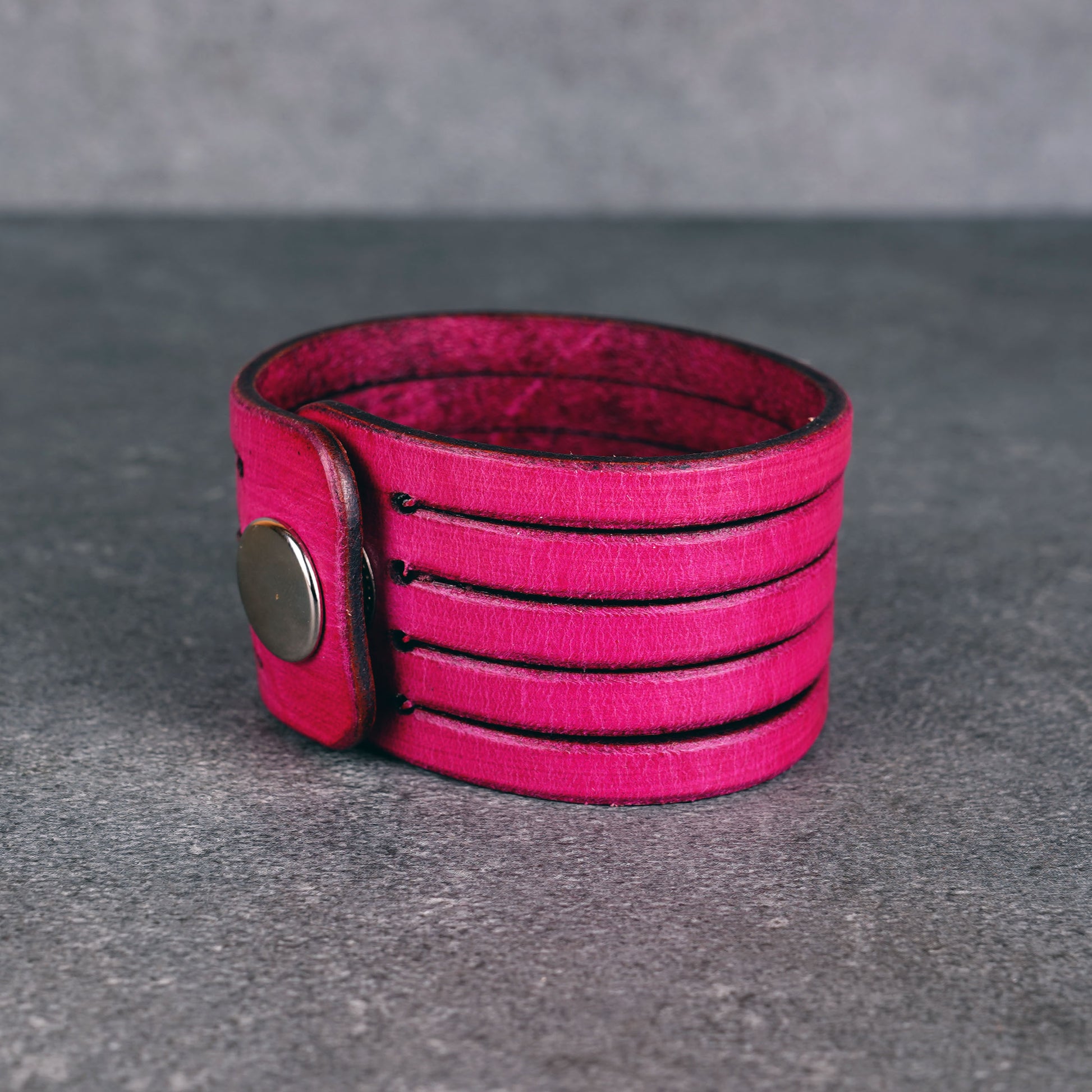 Pink leather wrap bracelet worn on wrist, handmade genuine leather cuff bracelet with layered strap design, minimalist magenta wristband for men and women
