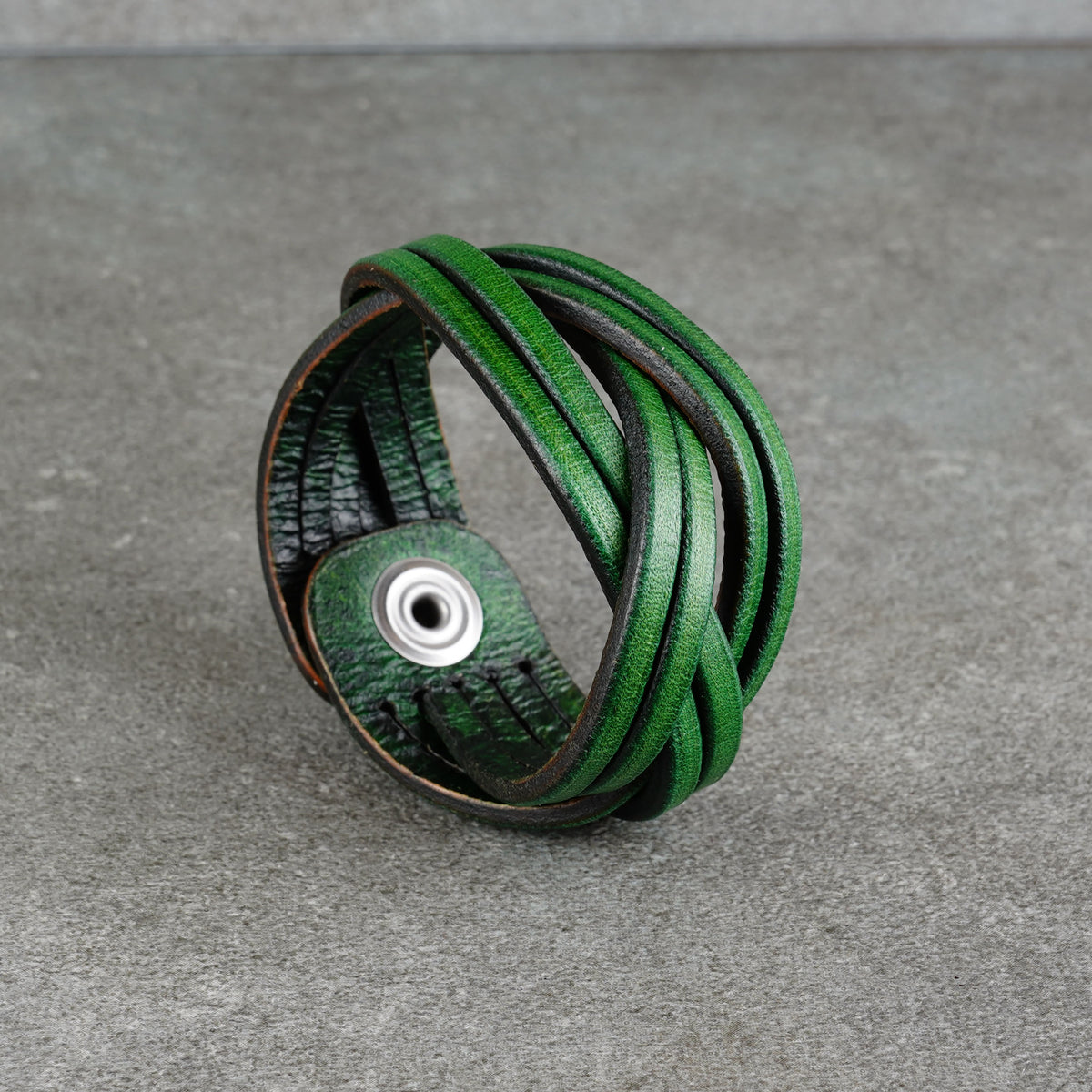 Close view of the bracelet’s layered leather loops and interior lining