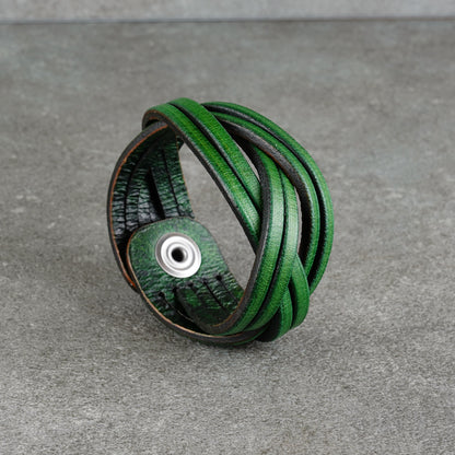Close view of the bracelet’s layered leather loops and interior lining