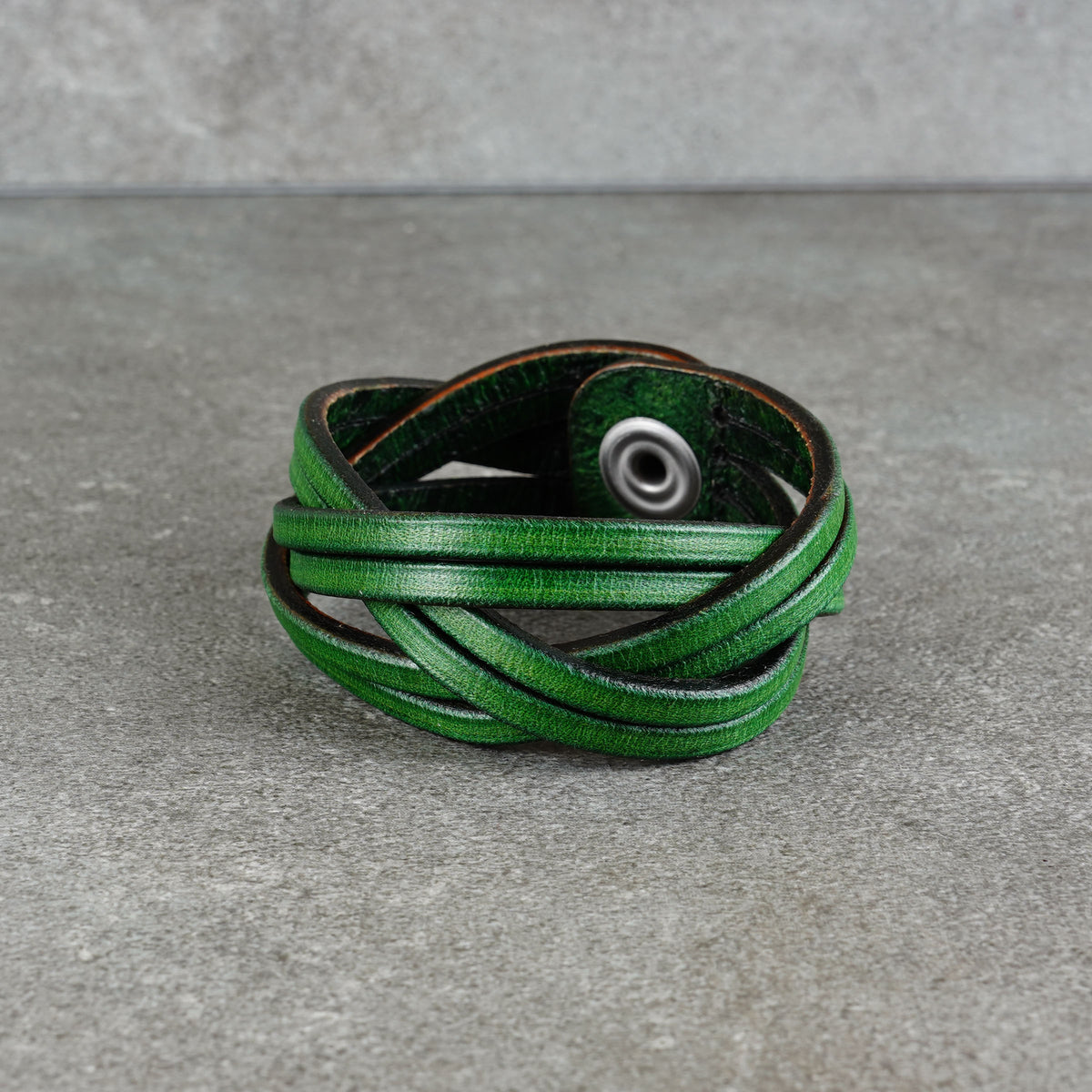 Low-angle view of the cuff with the snap fastener facing forward