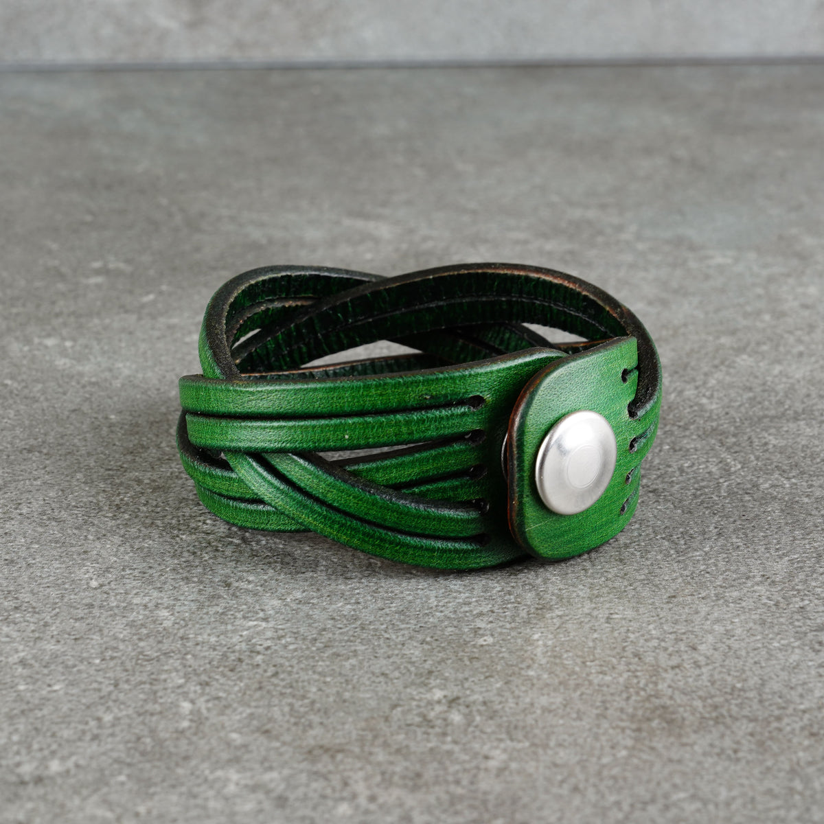 Low, centered view of the bracelet with the snap fastener at the side