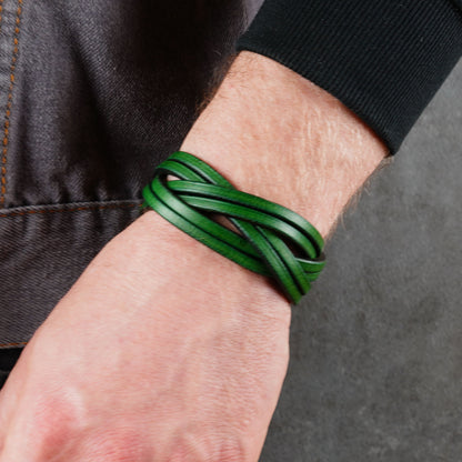 Green woven leather bracelet worn on a wrist with a tighter crop