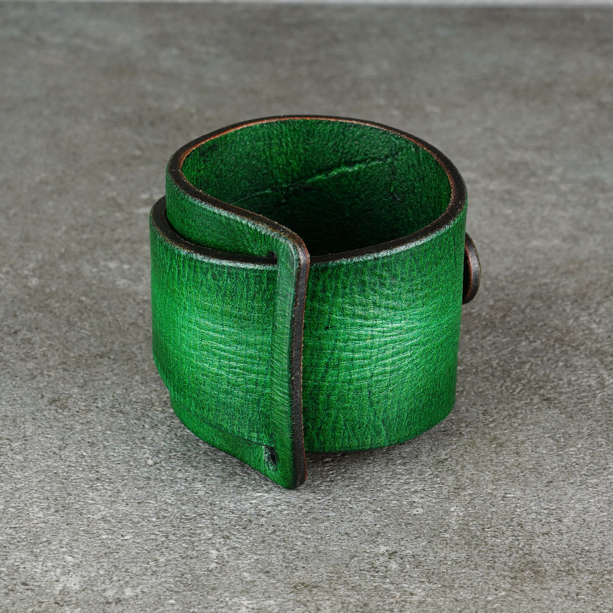 Macro view of the green leather texture and rounded edge