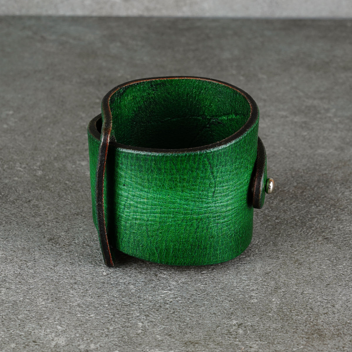 Front-facing view of the cuff showing its open shape and hardware
