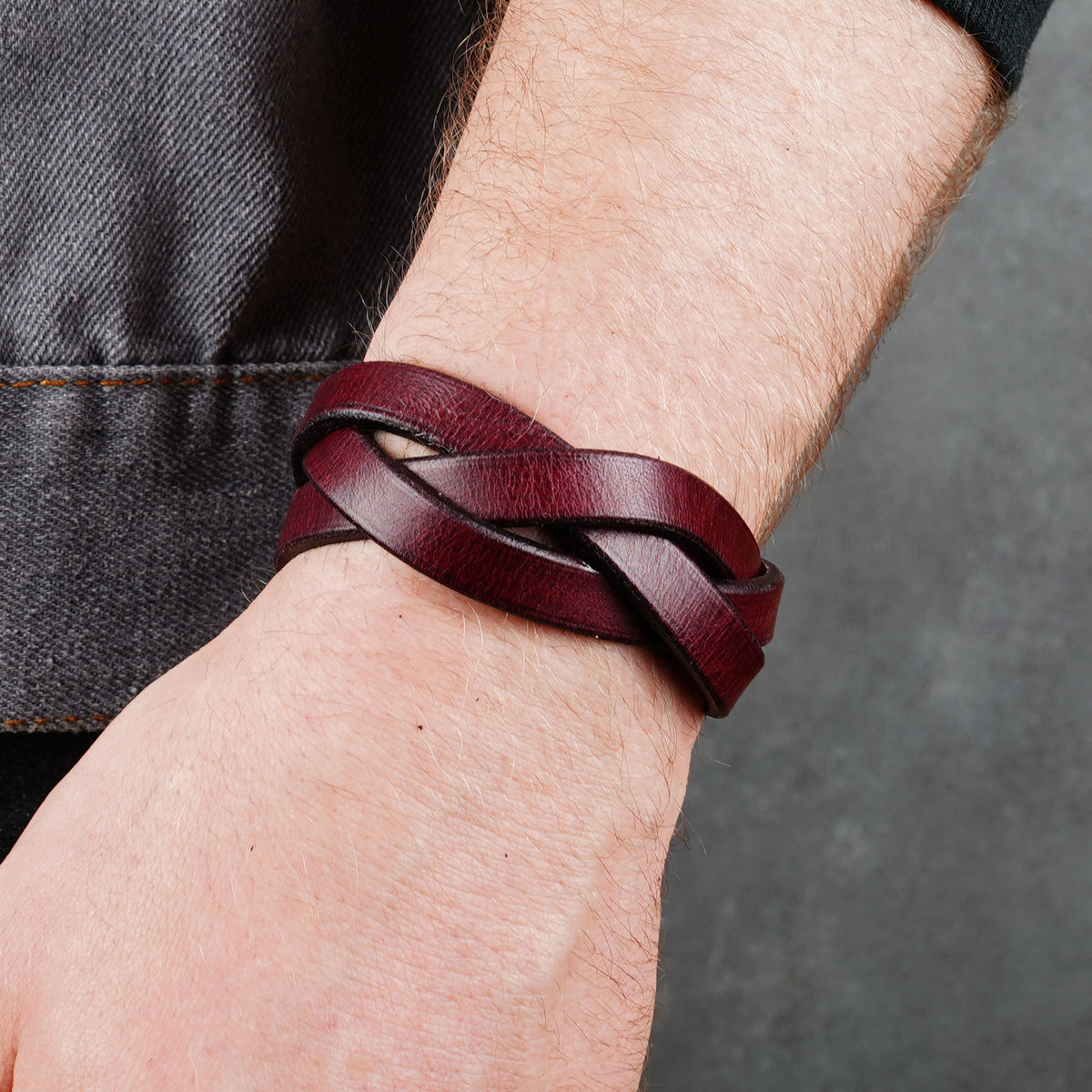 Worn bracelet close-up with the layered strap weave across the wrist
