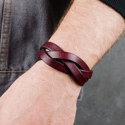Close wrist view with the bracelet crossing over denim