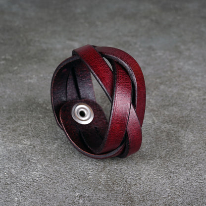 Close-up of the bracelet standing upright with the snap button visible